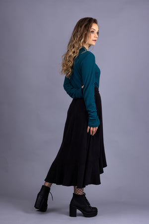 Rosalie darted midi skirt in black tencel twill, with turquoise rib knit top, side view