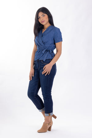 Forget-Me-Not Adeline wrap shirt pattern: quarter turn full length view of blue dotted short sleeve shirt on model