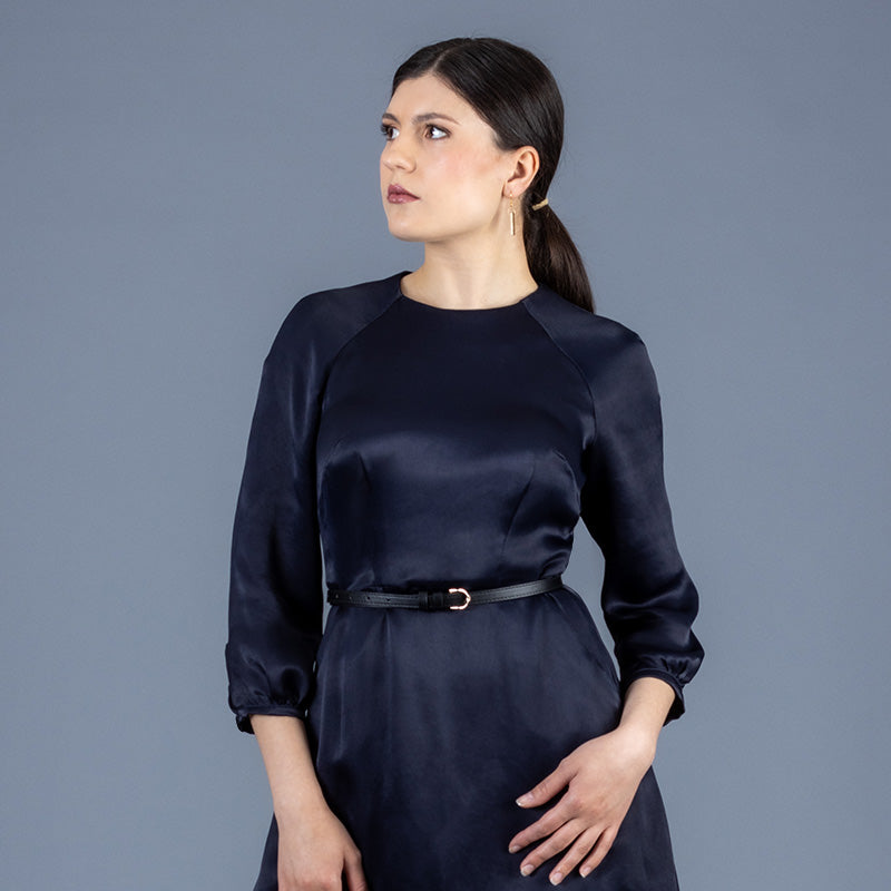 Forget-me-not Valerie raglan dress in navy satin, close up photo of front
