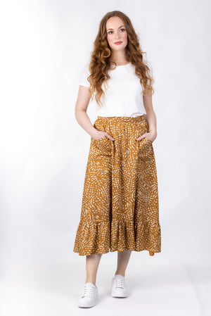 Forget-Me-Not Ella long skirt pattern in mustard, full-length front shot of model highlighting pockets