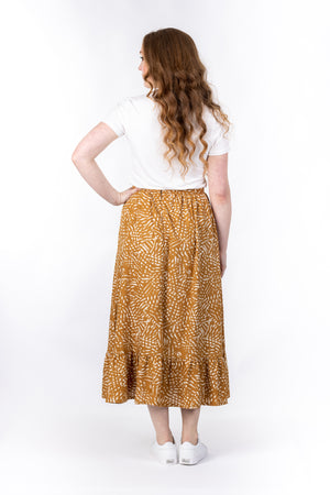 Forget-Me-Not Ella long skirt pattern in mustard, full-length rear shot of model
