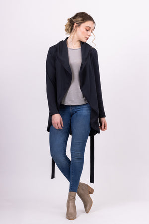 Long Kirsi cardigan in navy, worn open, with blue jeans, front view