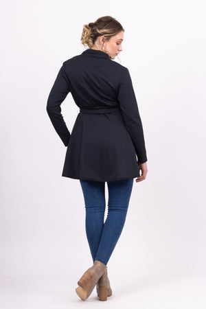 Long Kirsi cardigan in navy, worn closed, with blue jeans, back view