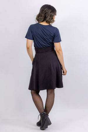 The Natalie skirt, a flared gored skirt pattern for women, made in black viscose twill, back view showing raised waistband.