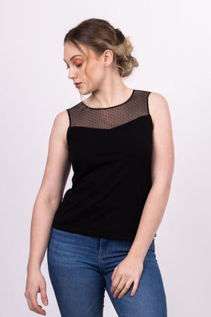 Sylvie knit top with black mesh contrast yoke, worn with blue jeans, close up of front view