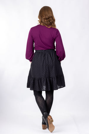 Forget-Me-Not Ella short skirt pattern in black, full-length rear shot of model