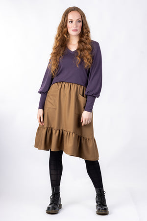 Forget-Me-Not Ella knee length skirt with pockets pattern in brown, full-length front shot of model